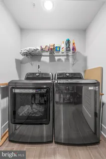 a stove top oven sitting inside of a kitchen