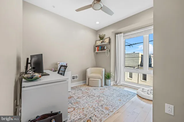 a bedroom with a bed and cabinets