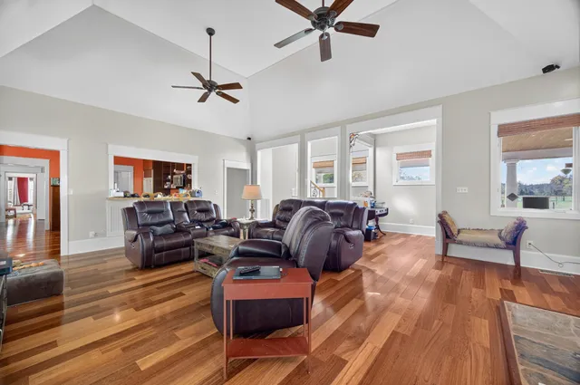 a bedroom with a bed and a large window with balcony view