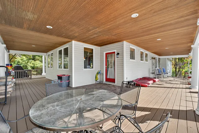 a living room with furniture wooden floor and a window