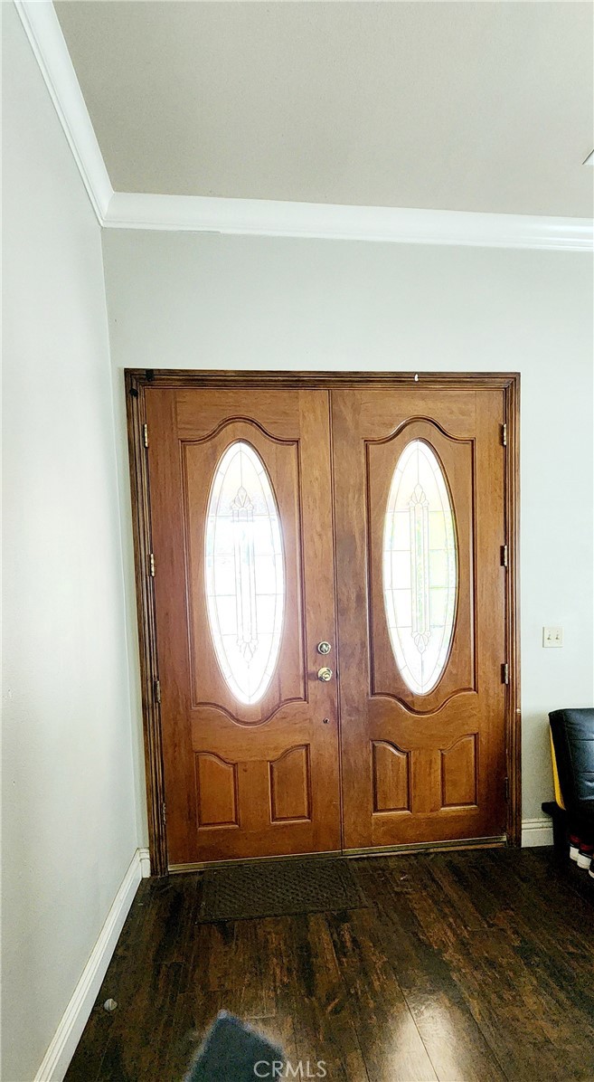 3112 1st Street Riverside, CA 92507 - Photo 6 of 61 a view of a livingroom with wooden floor and a potted plant
