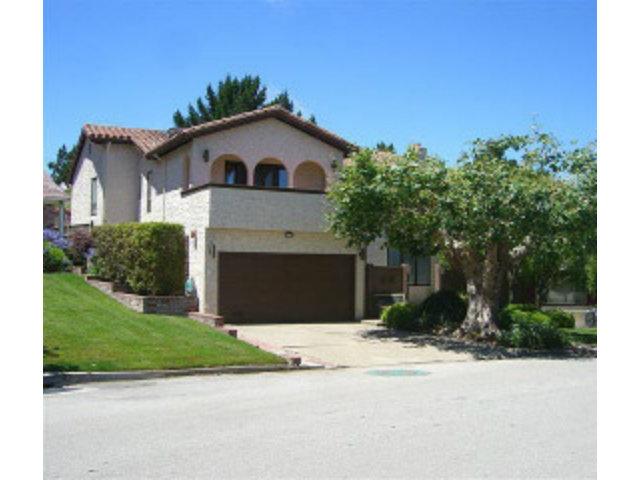 251 La Prenda Millbrae, CA 94030 - Photo 2 of 10 a front view of a house with a yard and garage