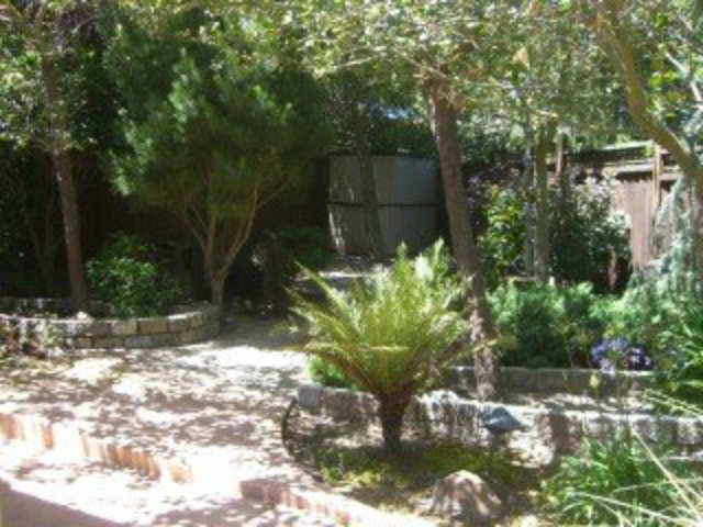 251 La Prenda Millbrae, CA 94030 - Photo 9 of 10 a backyard of a house with a yard and outdoor seating