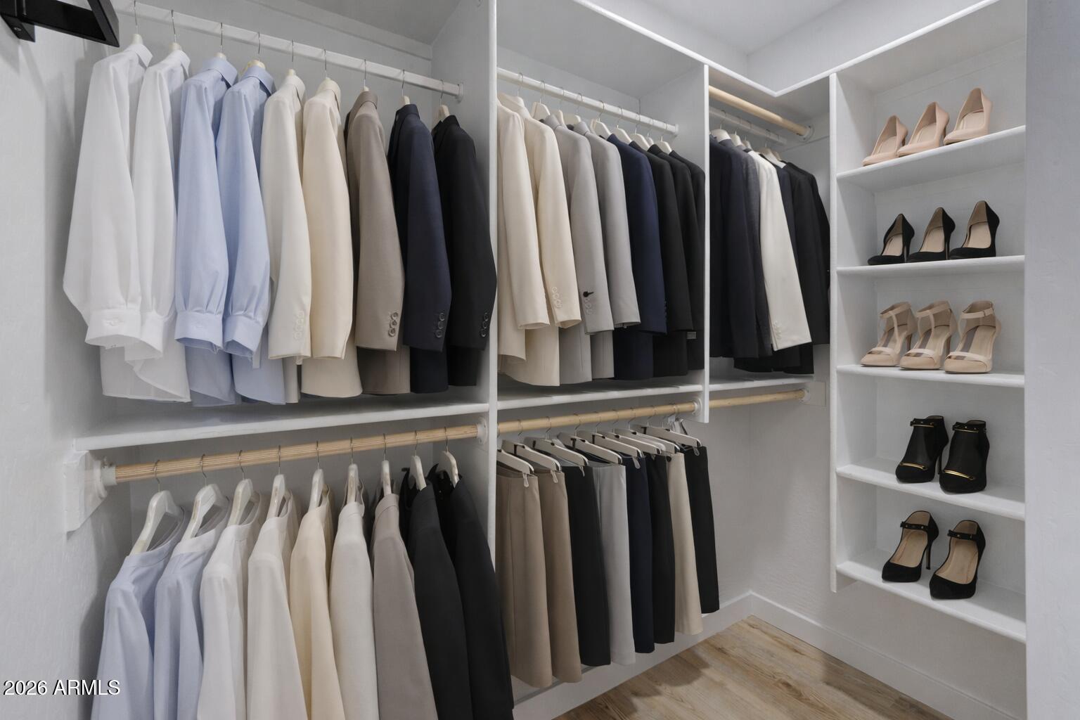 450 South Crismon Road, Unit 2 Mesa, AZ 85208 - Photo 12 of 21 a view of walk in closet with clothes and shoes