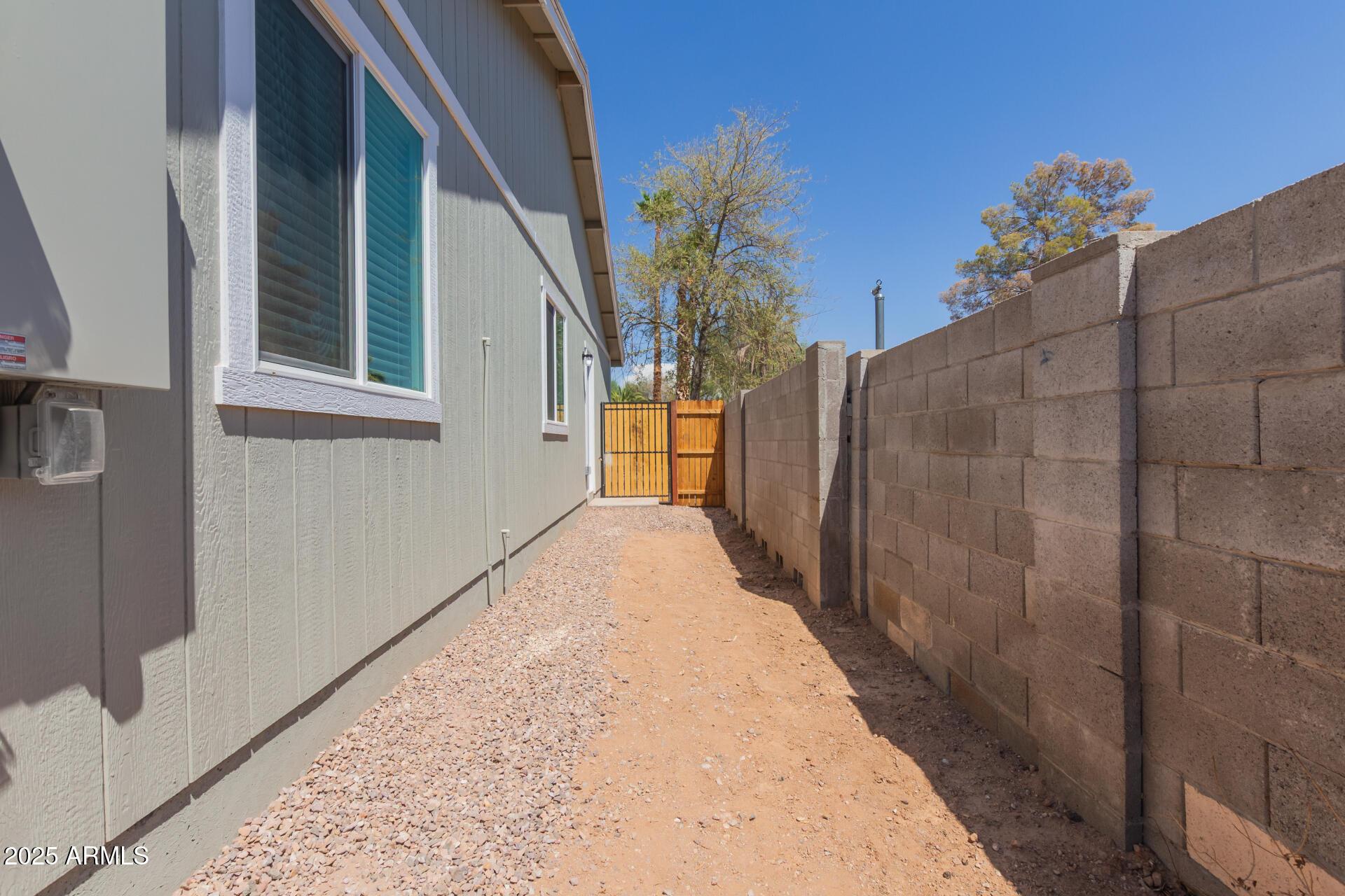 450 South Crismon Road, Unit 2 Mesa, AZ 85208 - Photo 19 of 21 a view of a house with a backyard