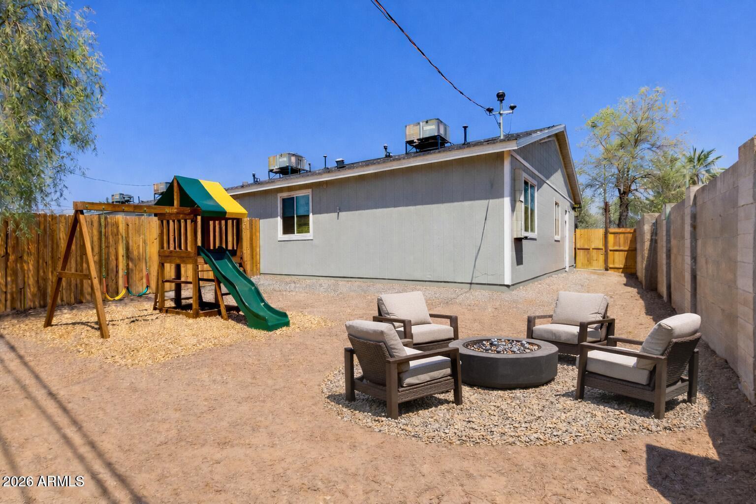 450 South Crismon Road, Unit 2 Mesa, AZ 85208 - Photo 20 of 21 a view of a patio with table and chairs and potted plants