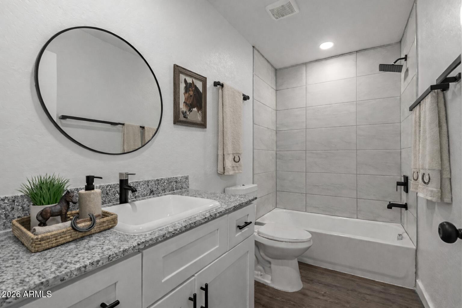 450 South Crismon Road, Unit 2 Mesa, AZ 85208 - Photo 8 of 21 a bathroom with a granite countertop sink a toilet and a mirror