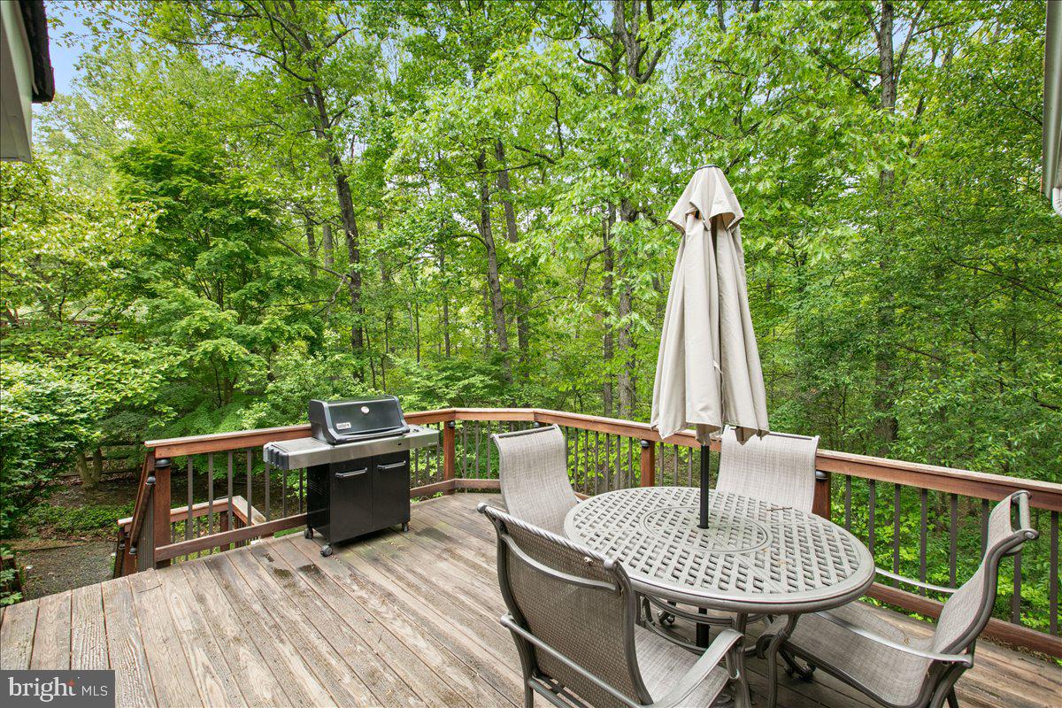 10741 Midsummer Drive Reston, VA 20191 - Photo 11 of 53 a patio with a table and chairs
