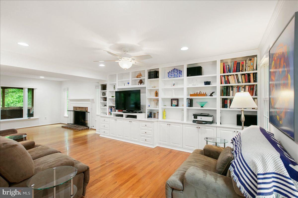 10741 Midsummer Drive Reston, VA 20191 - Photo 21 of 53 a living room with furniture and a flat screen tv