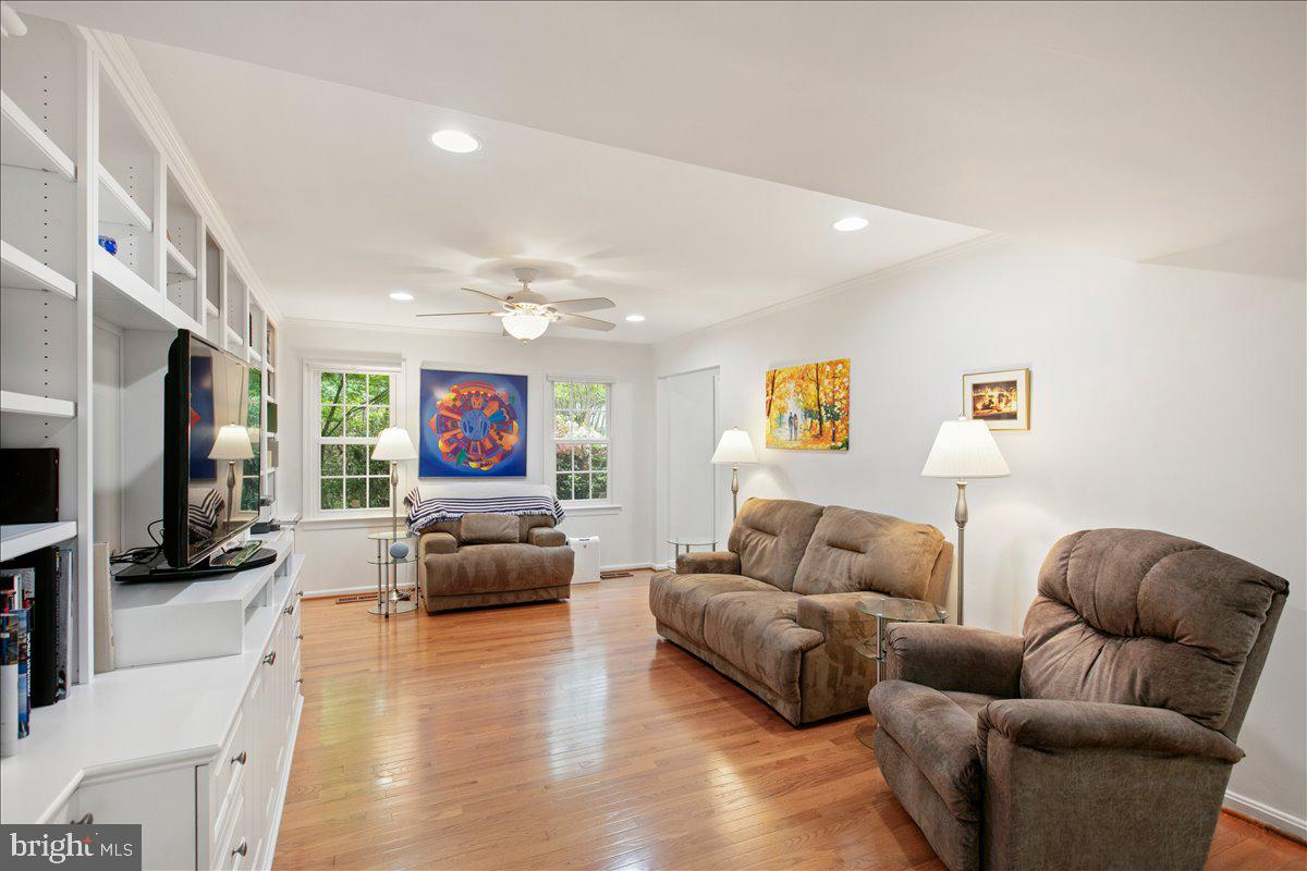10741 Midsummer Drive Reston, VA 20191 - Photo 22 of 53 a living room with furniture and a flat screen tv