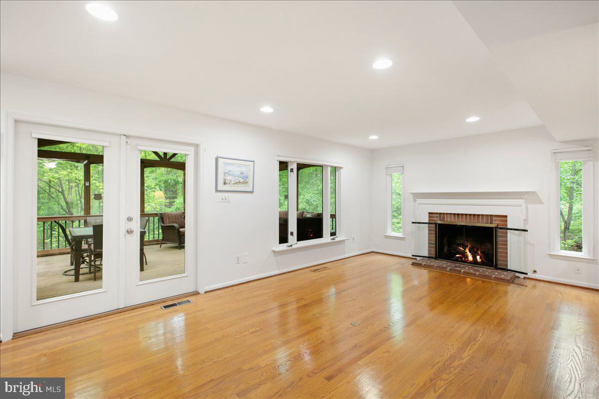 10741 Midsummer Drive Reston, VA 20191 - Photo 24 of 53 a view of an empty room with window and fire place