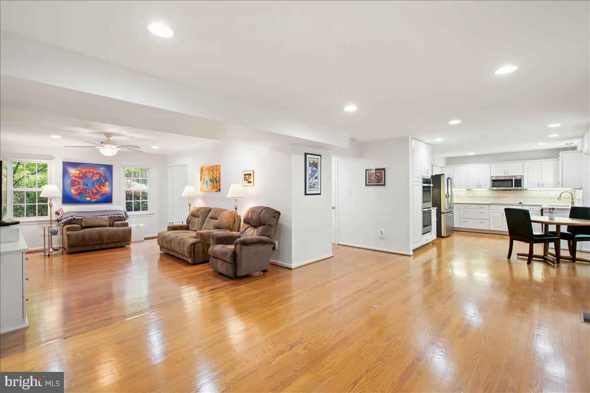 10741 Midsummer Drive Reston, VA 20191 - Photo 25 of 53 a living room with furniture and a flat screen tv