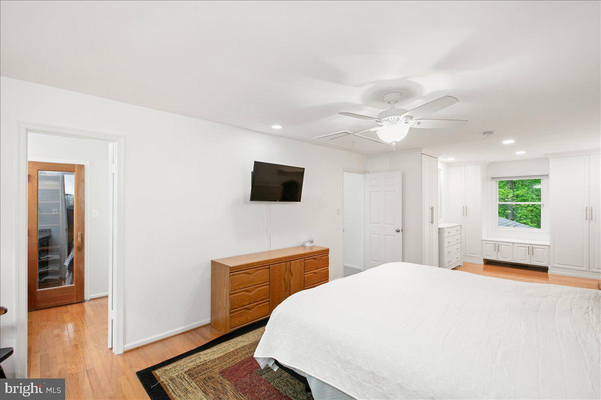 10741 Midsummer Drive Reston, VA 20191 - Photo 35 of 53 a bedroom with a bed and a flat screen tv
