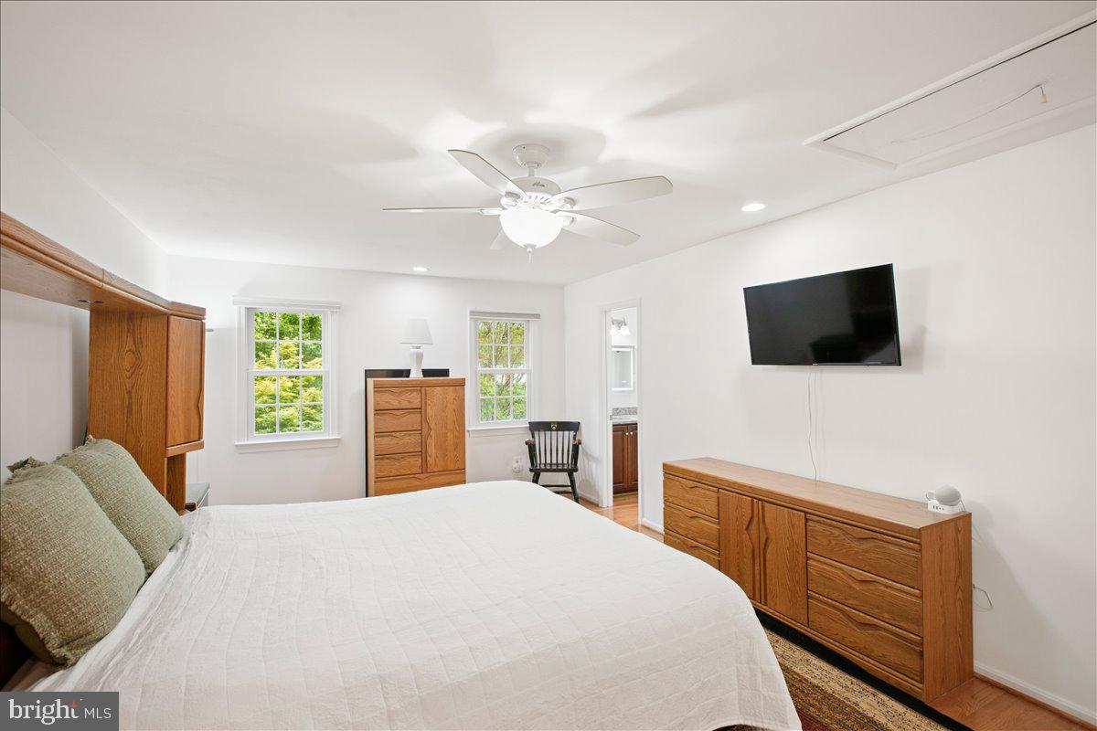 10741 Midsummer Drive Reston, VA 20191 - Photo 37 of 53 a bedroom with a bed and a flat screen tv