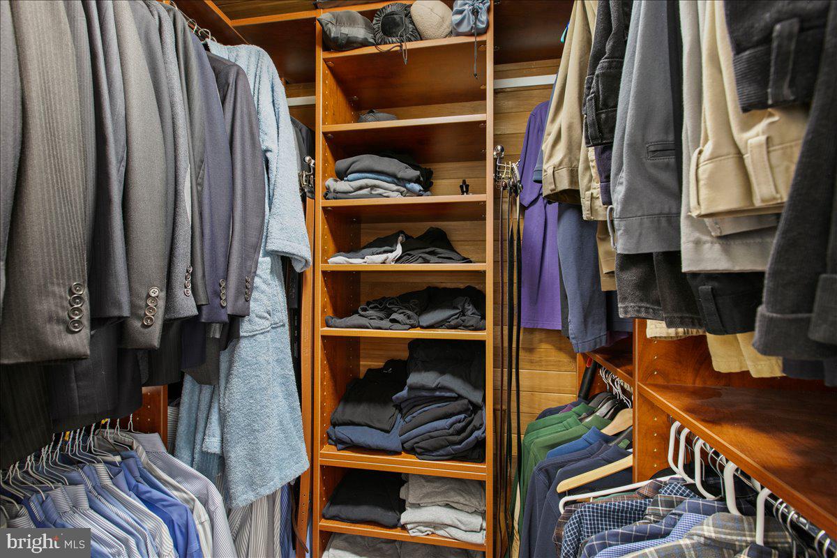 10741 Midsummer Drive Reston, VA 20191 - Photo 39 of 53 a view of walk in closet with clothes and shoes