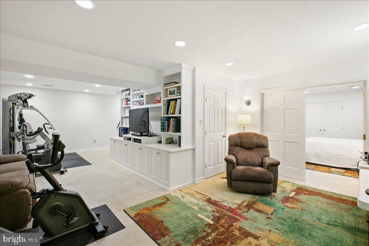 10741 Midsummer Drive Reston, VA 20191 - Photo 47 of 53 a living room with furniture and a flat screen tv
