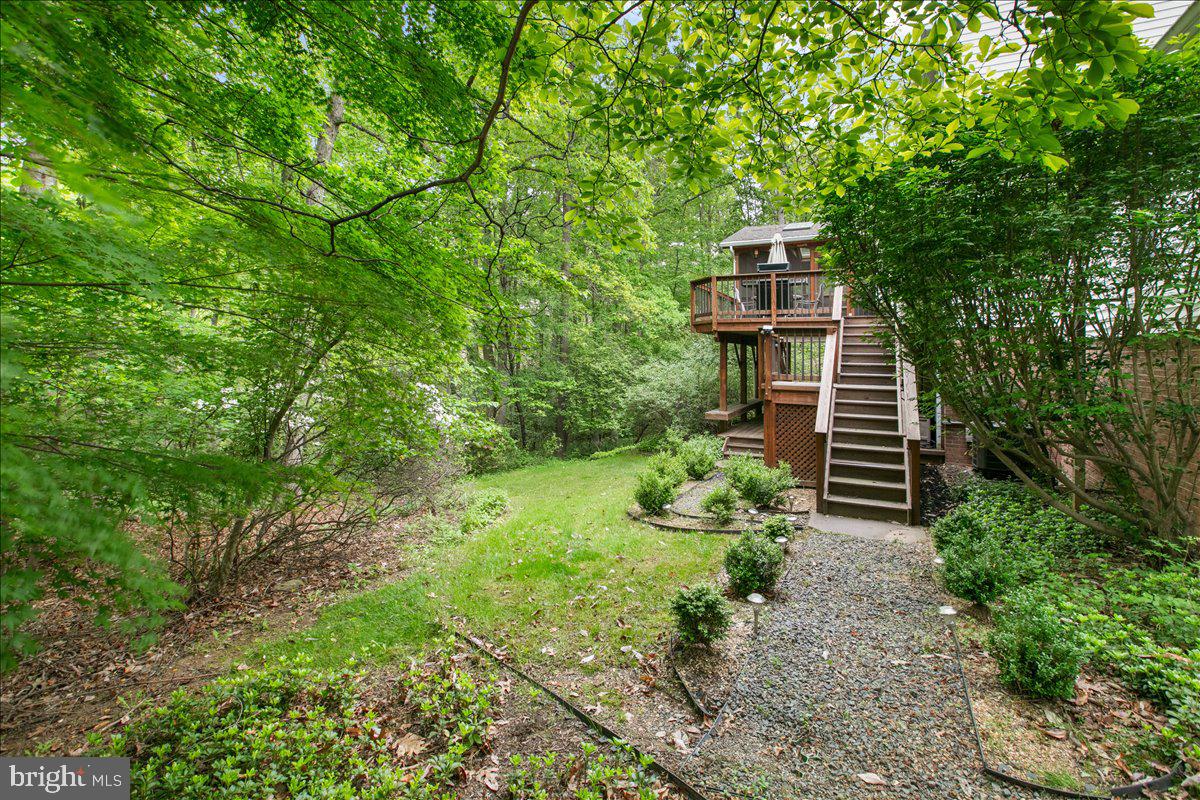 10741 Midsummer Drive Reston, VA 20191 - Photo 5 of 53 a view of a garden with wooden stairs