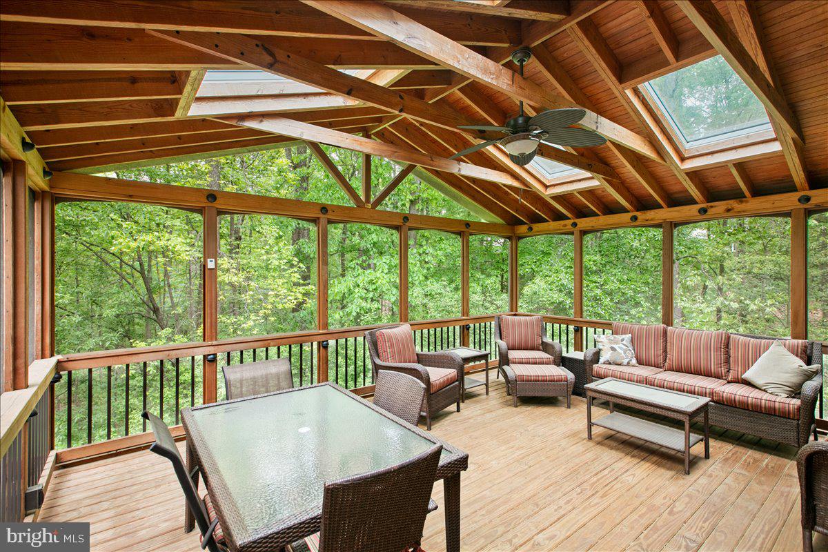 10741 Midsummer Drive Reston, VA 20191 - Photo 8 of 53 a balcony with furniture and wooden floor