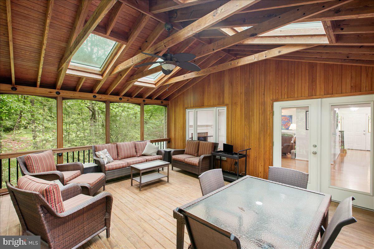 10741 Midsummer Drive Reston, VA 20191 - Photo 9 of 53 a living room with furniture and a large window