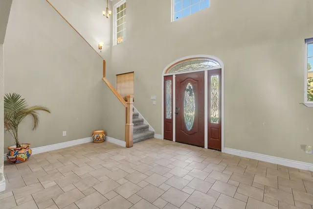 a view of a livingroom with furniture and staircase