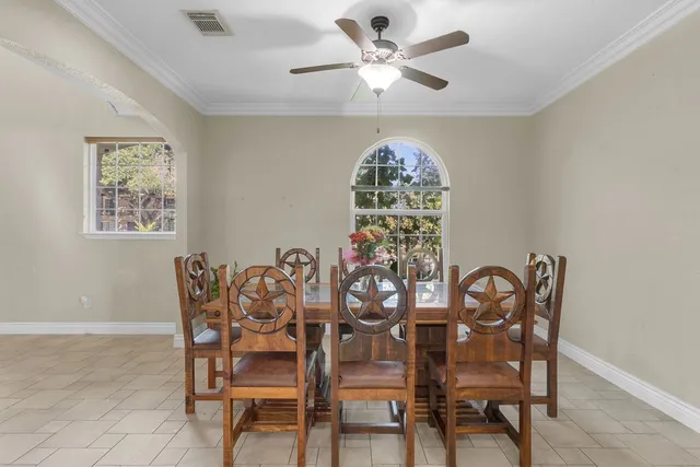 a dining room with furniture and window
