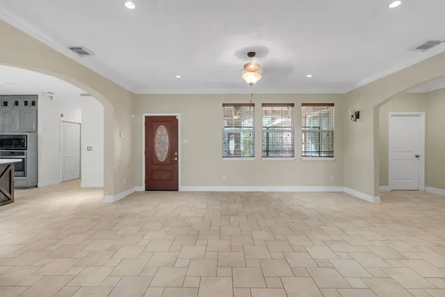 a view of a big room with closet and windows