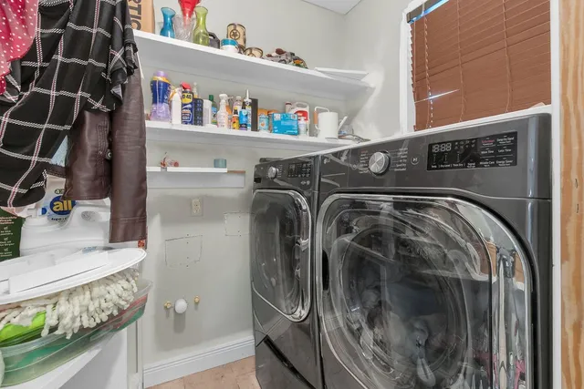 a view of a livingroom with furniture and windows