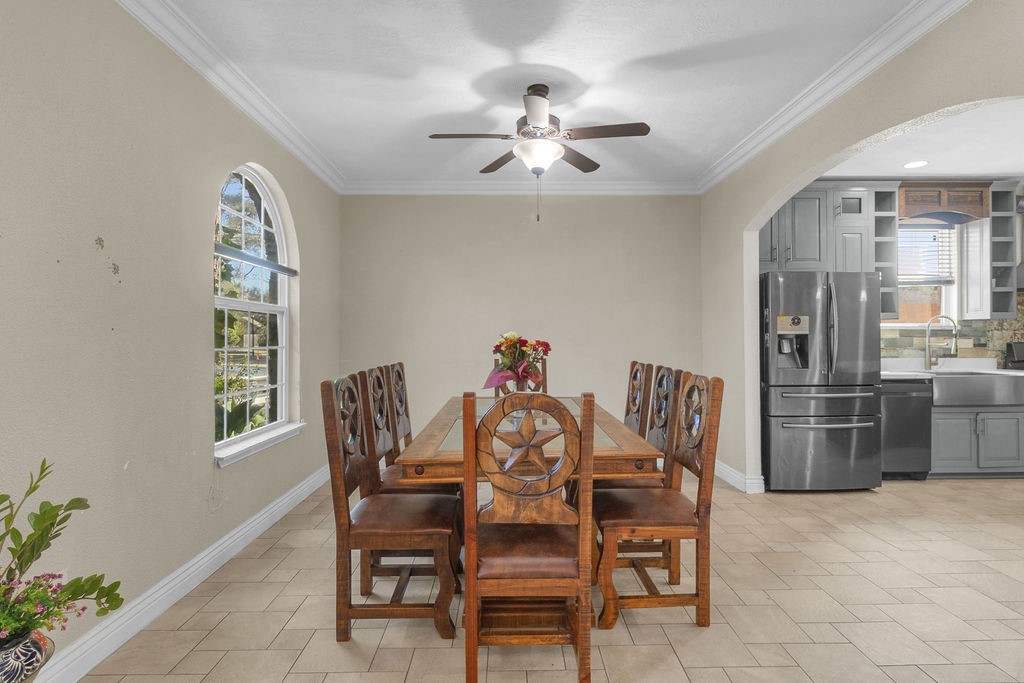 16017 Congo Lane Jersey Village, TX 77040 - Photo 3 of 13 a dining room with furniture a chandelier and window