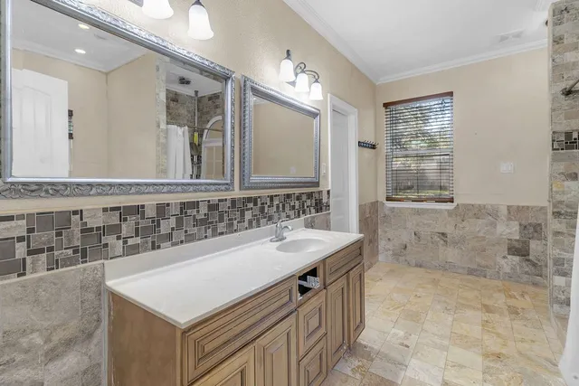 a bathroom with a tub and shower