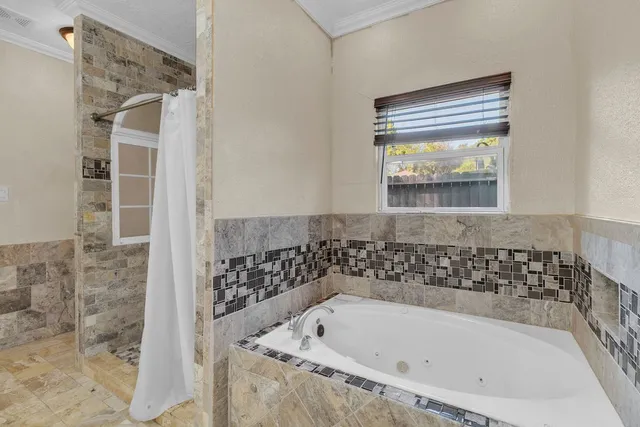 a bathroom with a granite countertop toilet a sink and a shower
