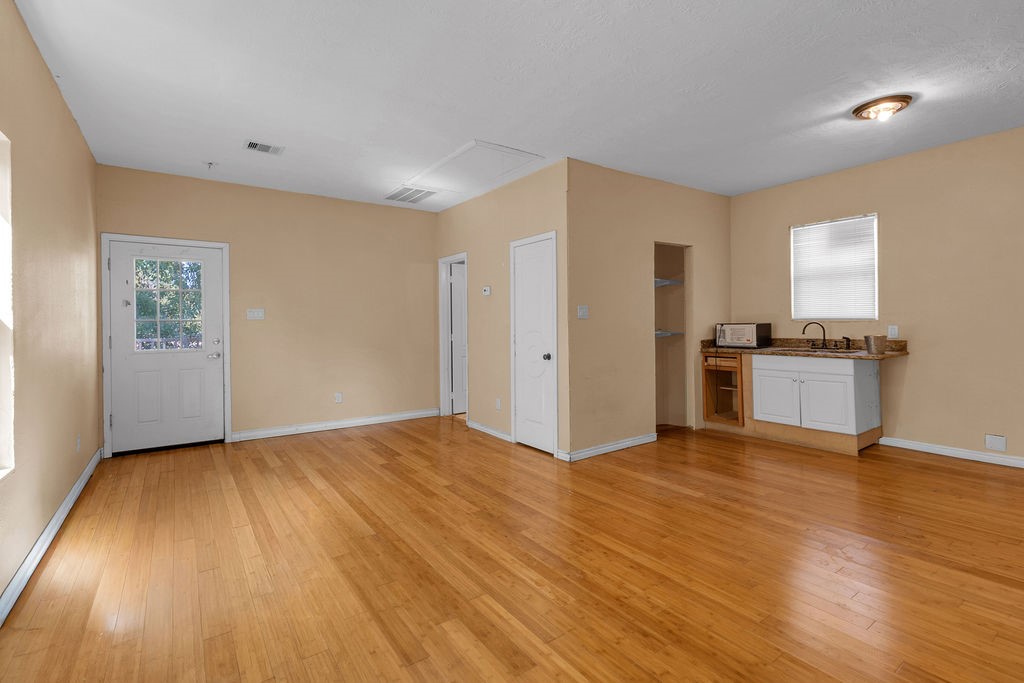 16017 Congo Lane Jersey Village, TX 77040 - Photo 9 of 13 a view of a kitchen with wooden floor electronic appliances and window