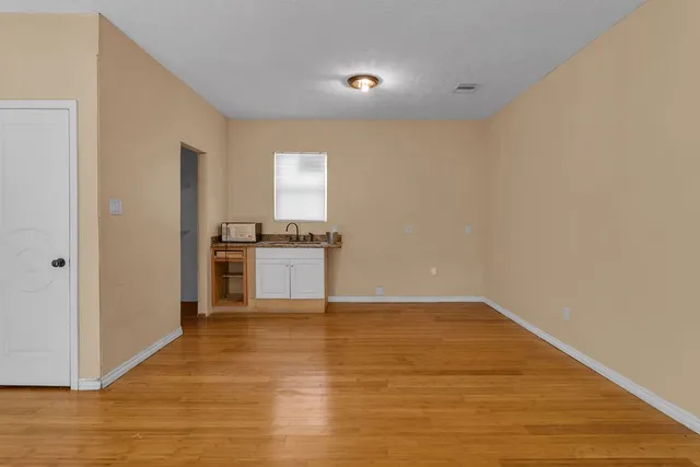 a view of kitchen with wooden floor
