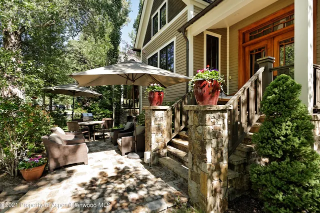 a view of a chairs and table in the patio