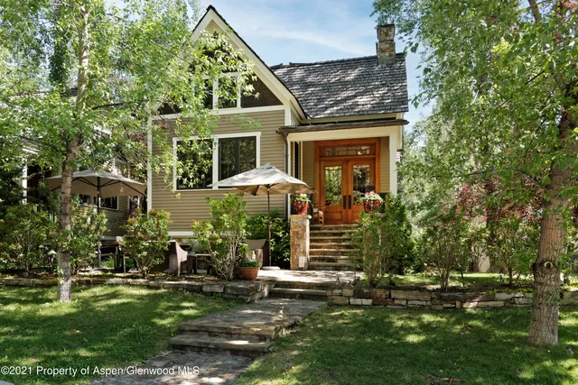 front view of a house with a yard