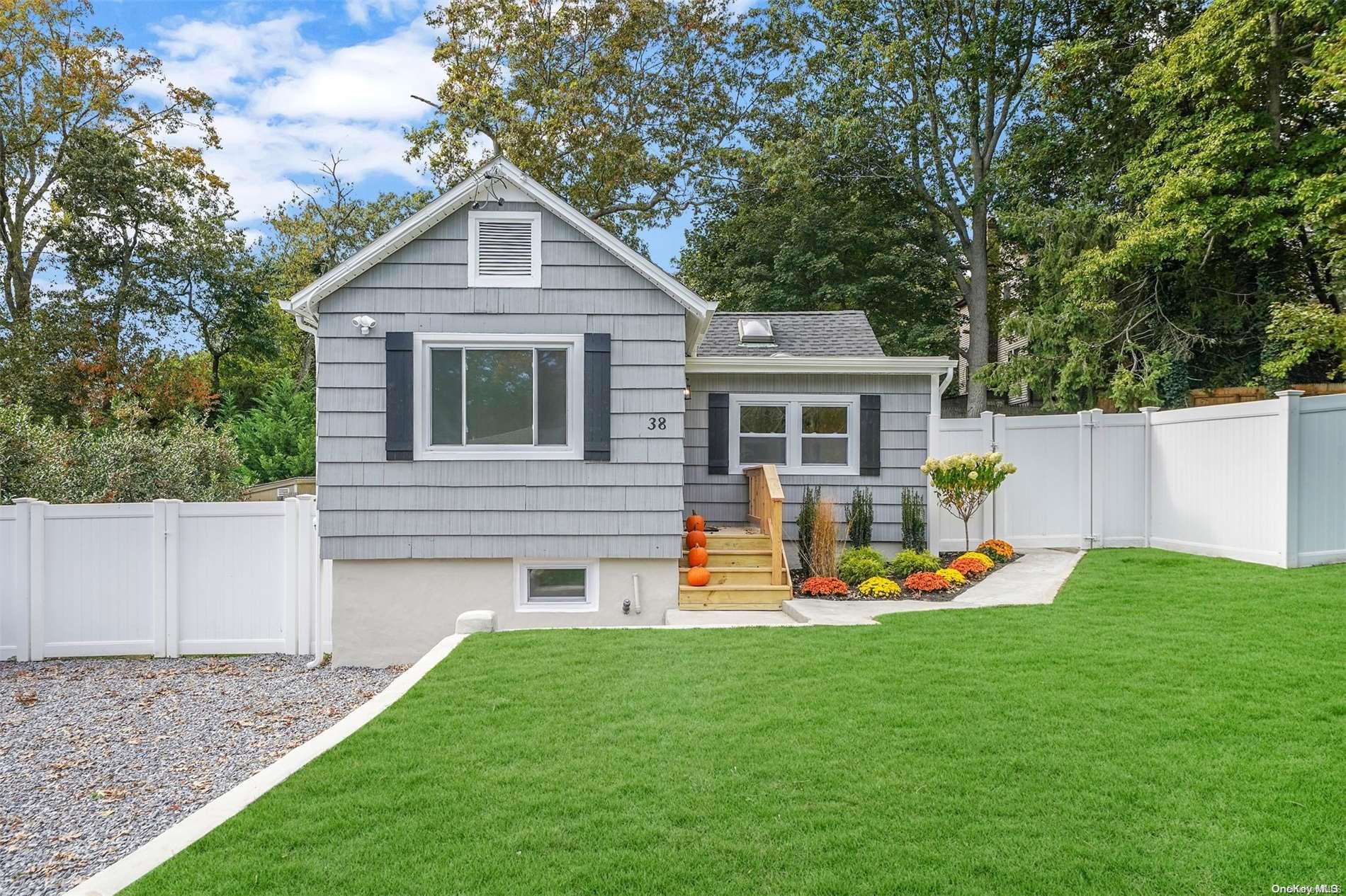 38 Tarpon Road Rocky Point, NY 11778 - Photo 1 of 1 a front view of a house with a yard