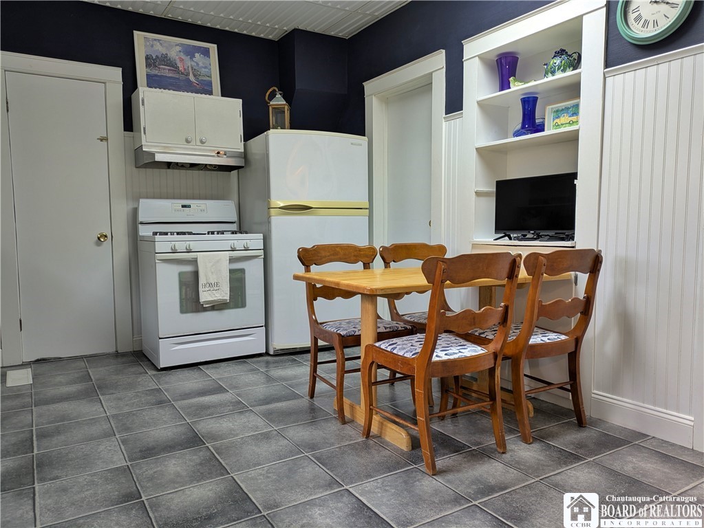33 Maple Street Ellery, NY 14712 - Photo 9 of 40 Eat in kitchen with shelving for storage and a tv,