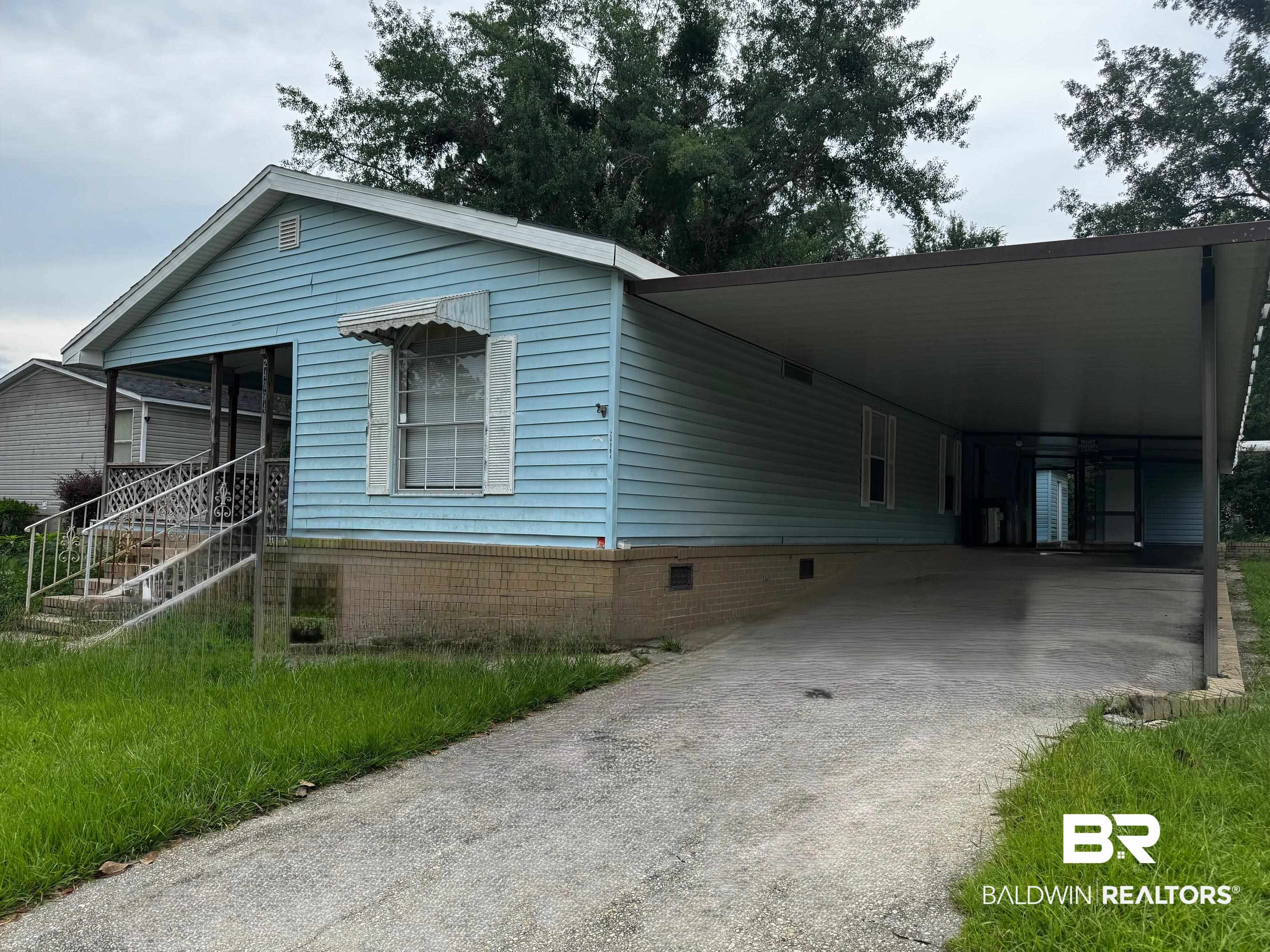24994 Pompano Drive Elberta, AL 36530 - Photo 2 of 14 View of front of property with driveway, crawl space, and an attached carport
