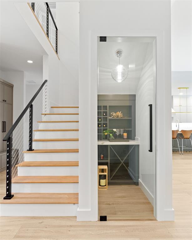 6446 Lange Circle Dallas, TX 75214 - Photo 14 of 40 a view of entryway and hall with wooden floor