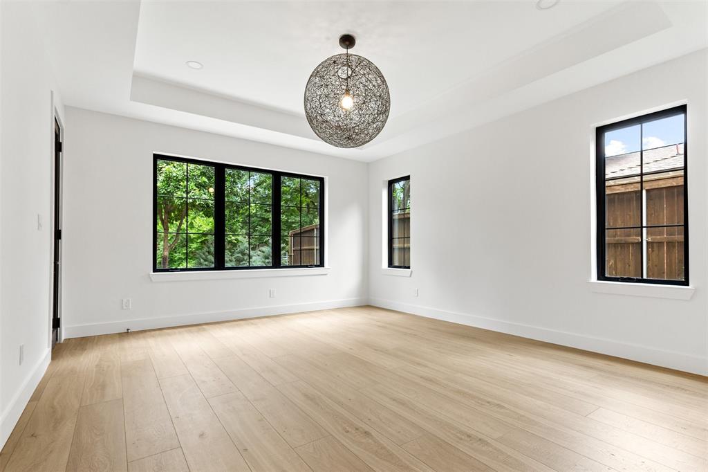 6446 Lange Circle Dallas, TX 75214 - Photo 17 of 40 an empty room with wooden floor and windows