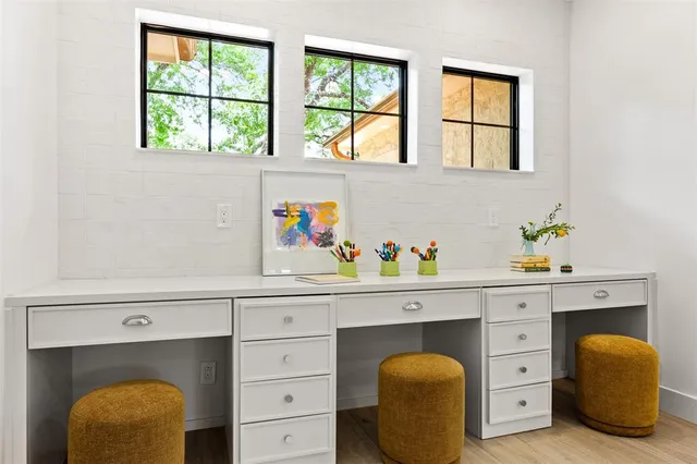 an empty room with windows and entrance