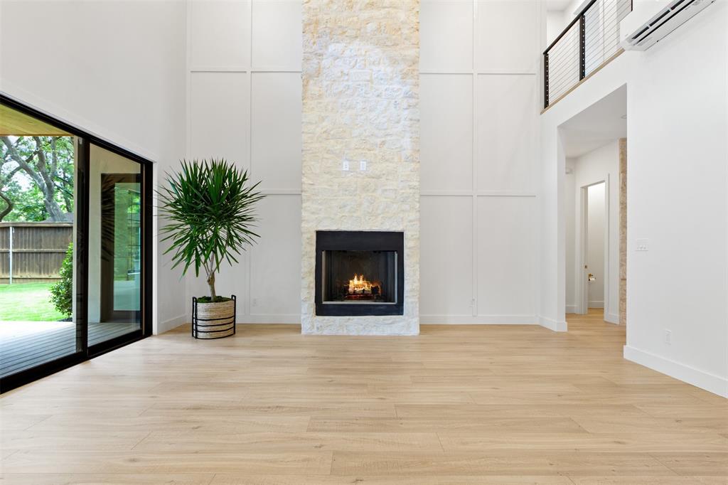 6446 Lange Circle Dallas, TX 75214 - Photo 5 of 40 a view of a livingroom with a fireplace and a rug floor