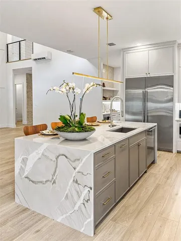 a bathroom with a double vanity sink and mirror
