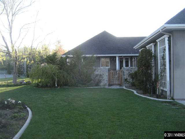 1395 View Reno Nv 89511 Reno, NV 89511 - Photo 4 of 13 a backyard of a house with lots of green space