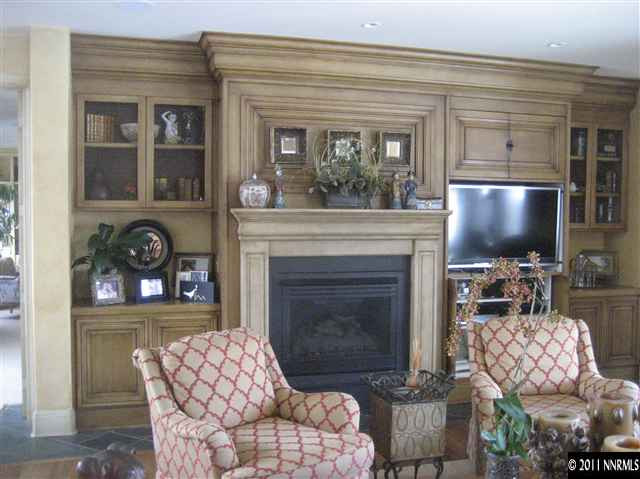 1395 View Reno Nv 89511 Reno, NV 89511 - Photo 5 of 13 a living room with furniture a flat screen tv and a fireplace