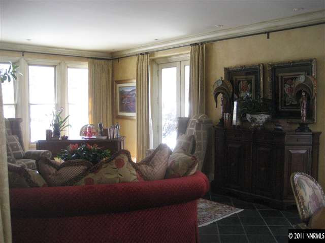 1395 View Reno Nv 89511 Reno, NV 89511 - Photo 6 of 13 a living room with furniture and a floor to ceiling window
