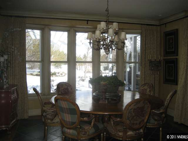 1395 View Reno Nv 89511 Reno, NV 89511 - Photo 9 of 13 a view of a dining room with furniture and chandelier