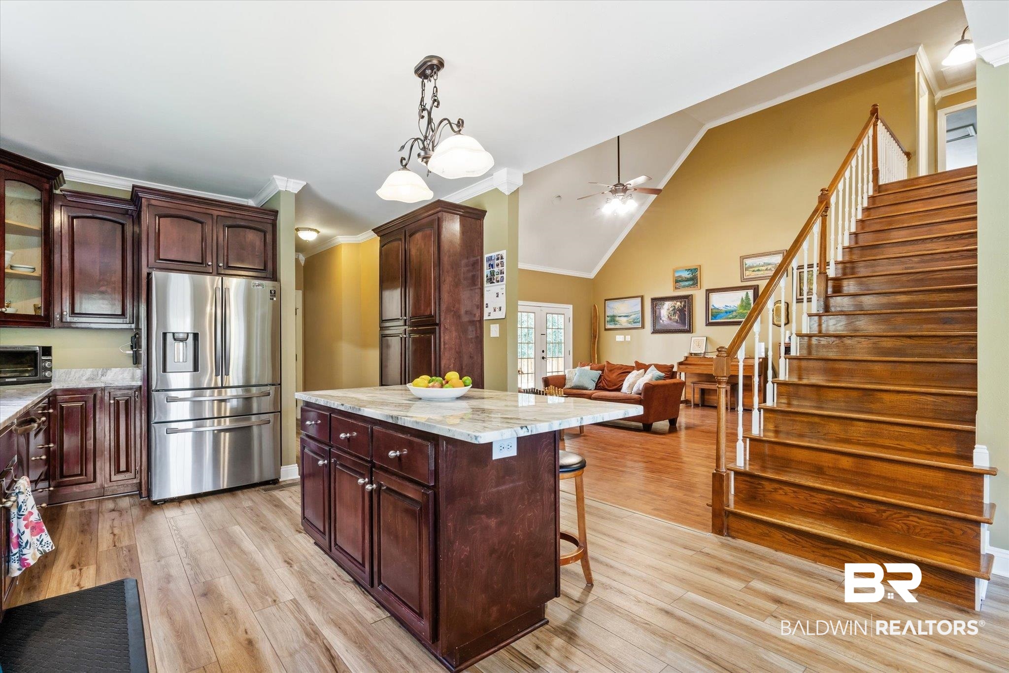 72 Limestone Drive Jackson, AL 36545 - Photo 7 of 38 Kitchen with stainless steel fridge, light hardwood / wood-style floors, a center island, ornamental molding, and ceiling fan
