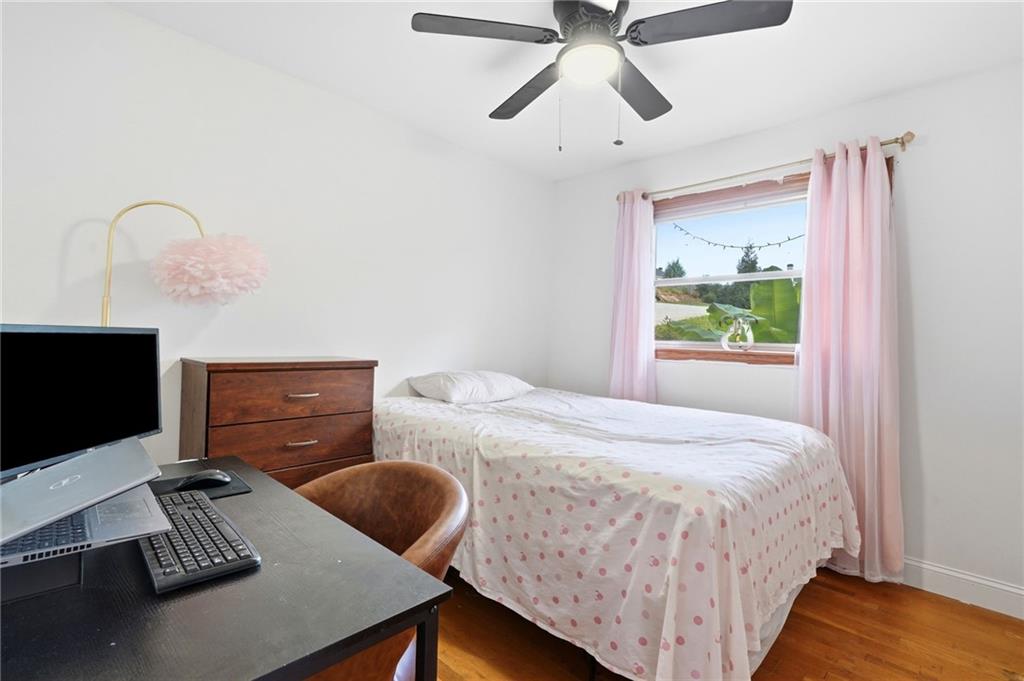 430 Church Road Southwest Marietta, GA 30060 - Photo 15 of 35 a bedroom with a bed and a desk