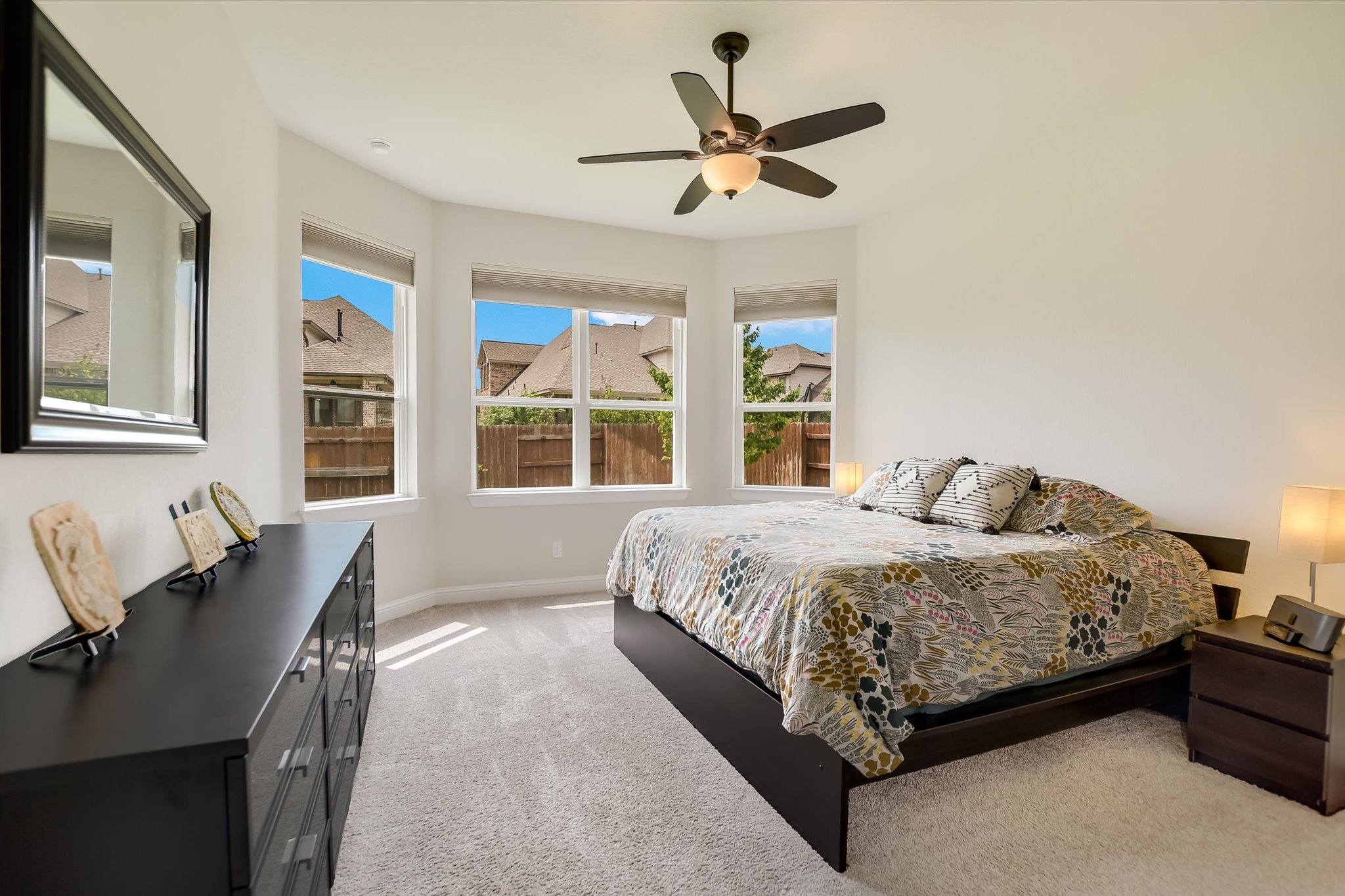 2009 Waterview Road Georgetown, TX 78628 - Photo 12 of 22 a spacious bedroom with a bed a window and mirror