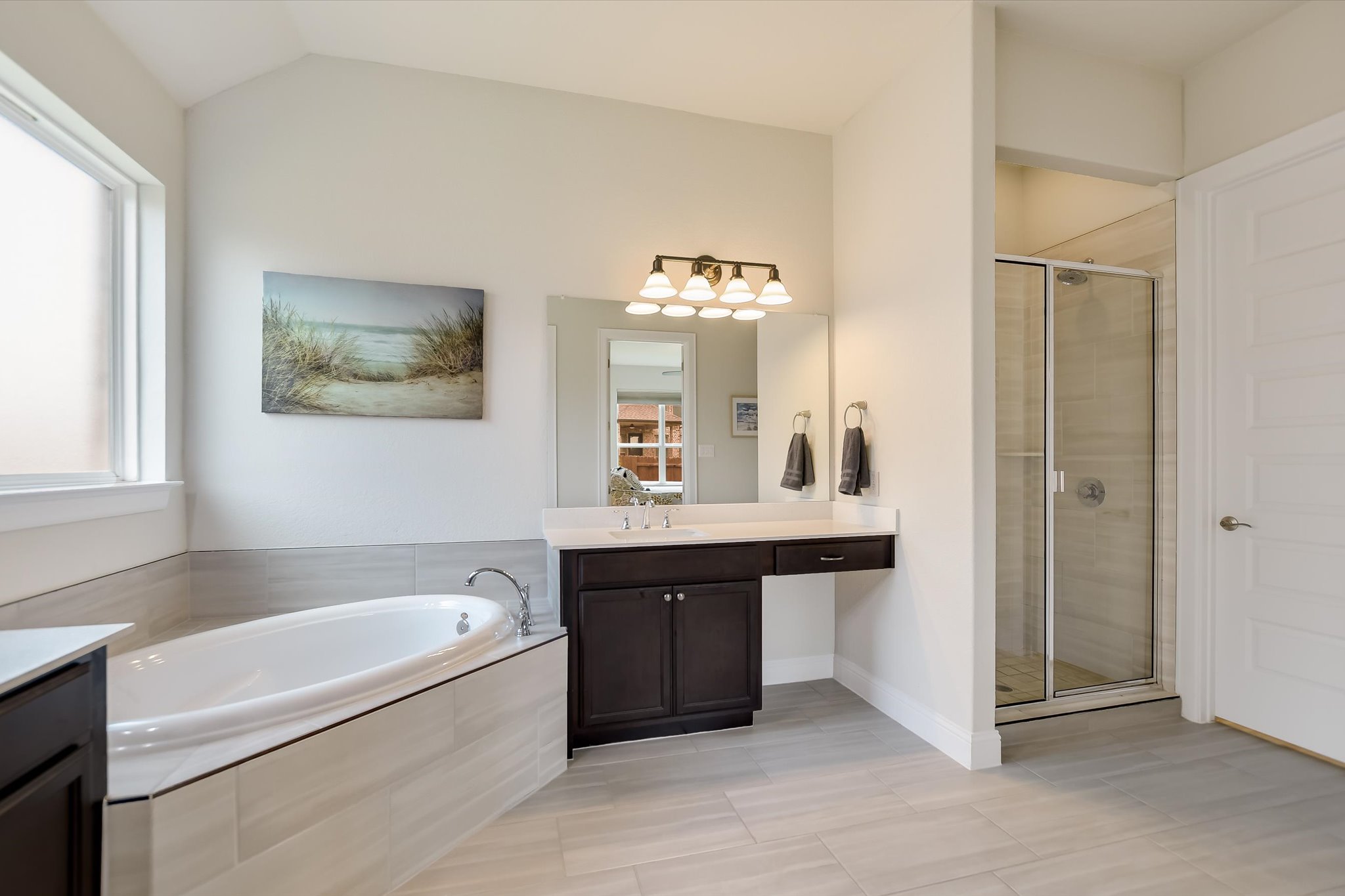2009 Waterview Road Georgetown, TX 78628 - Photo 14 of 22 a bathroom with a tub a sink and a mirror